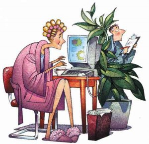 "woman working on computer at home in pjs"